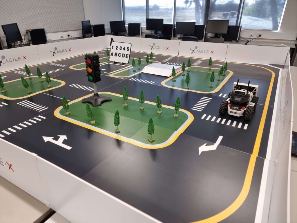 LIMO education robot on a simulation table.